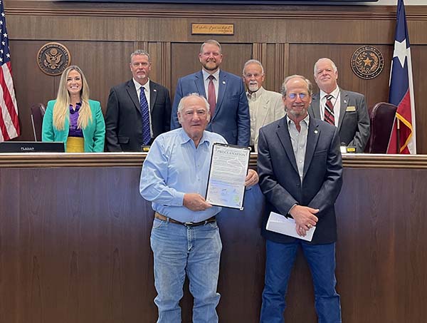Photo of members of Thriving Hearts receive proclamation for October 2025 recognized as Domestic Violence Awareness Month in Guadalupe County, TX.